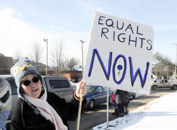 Gay Baldwin displays her sign during a Jan. 20 women’s march in the village of Walworth on the one-year anniversary of President Trump’s inauguration. See story and more photos on 1B. (Photo by Chris Schultz/Regional News)
