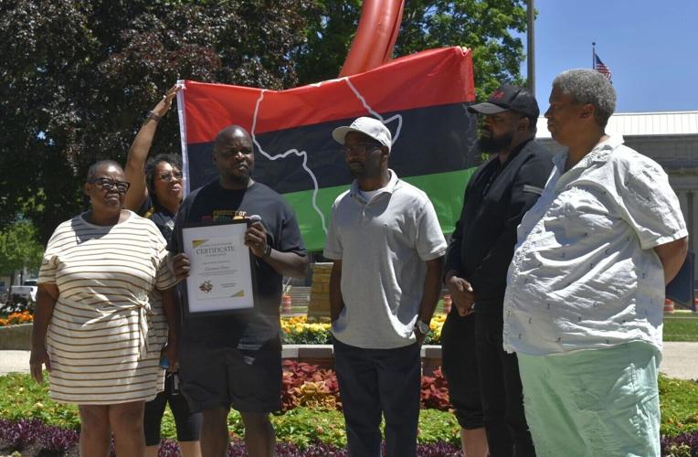 Deshaun Foster receives certificate from Juneteenth event organizers