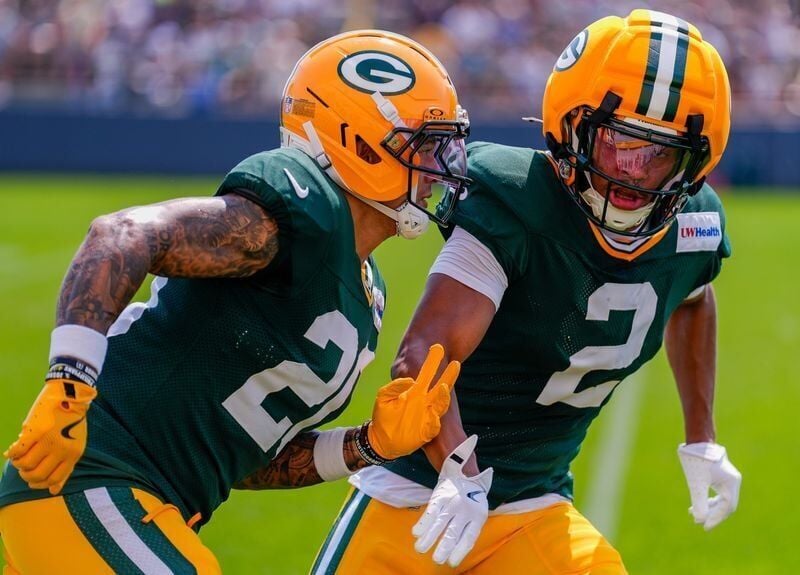 Green Bay Packers cornerbacks Domani Jackson (20) and Brandon Cisse (2) run through a drill during practice on Tuesday, Aug. 4, 2026, at Ray Nitschke Field in Ashwaubenon, Wisconsin. Tork Mason/USA TODAY NETWORK-Wisconsin