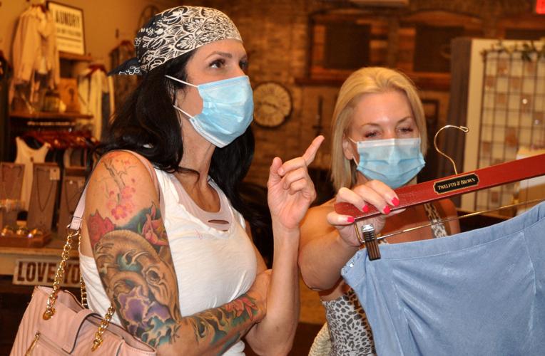 Michelle Thompson of Arkansas, left, and Melissa Borst of Chicago wear their facemasks