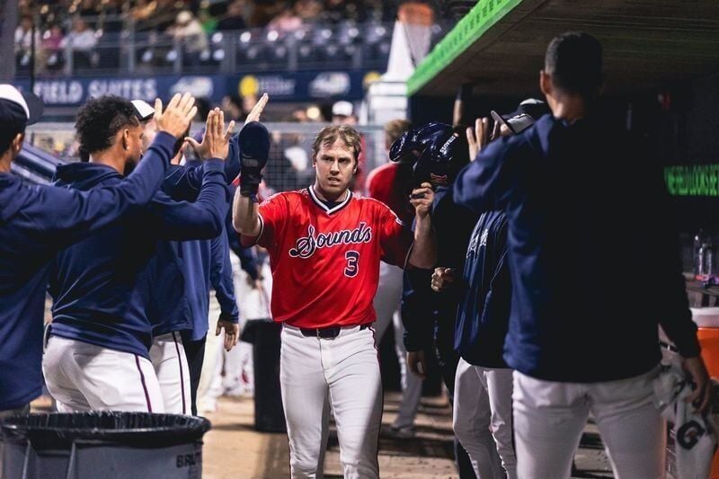Jacob Hurtubise receives congratulations from the Nashville Sounds dugout during the 2026 season.
