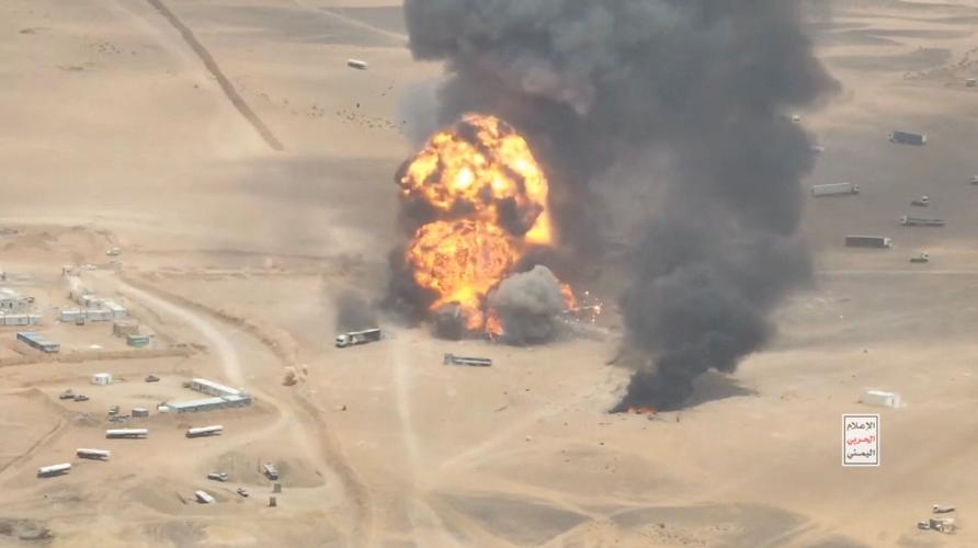 Smoke rises from trucks, near Al-Wadiah