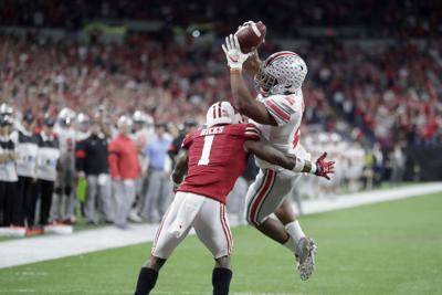 uw football jump image 7-23