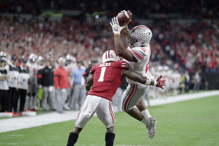 uw football jump image 7-23