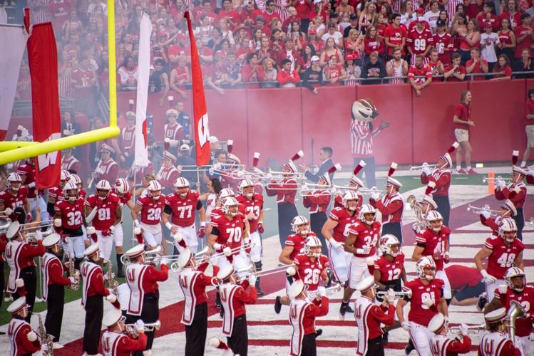 Members of the University of Wisconsin-Madison marching band perform while the Badgers take the field