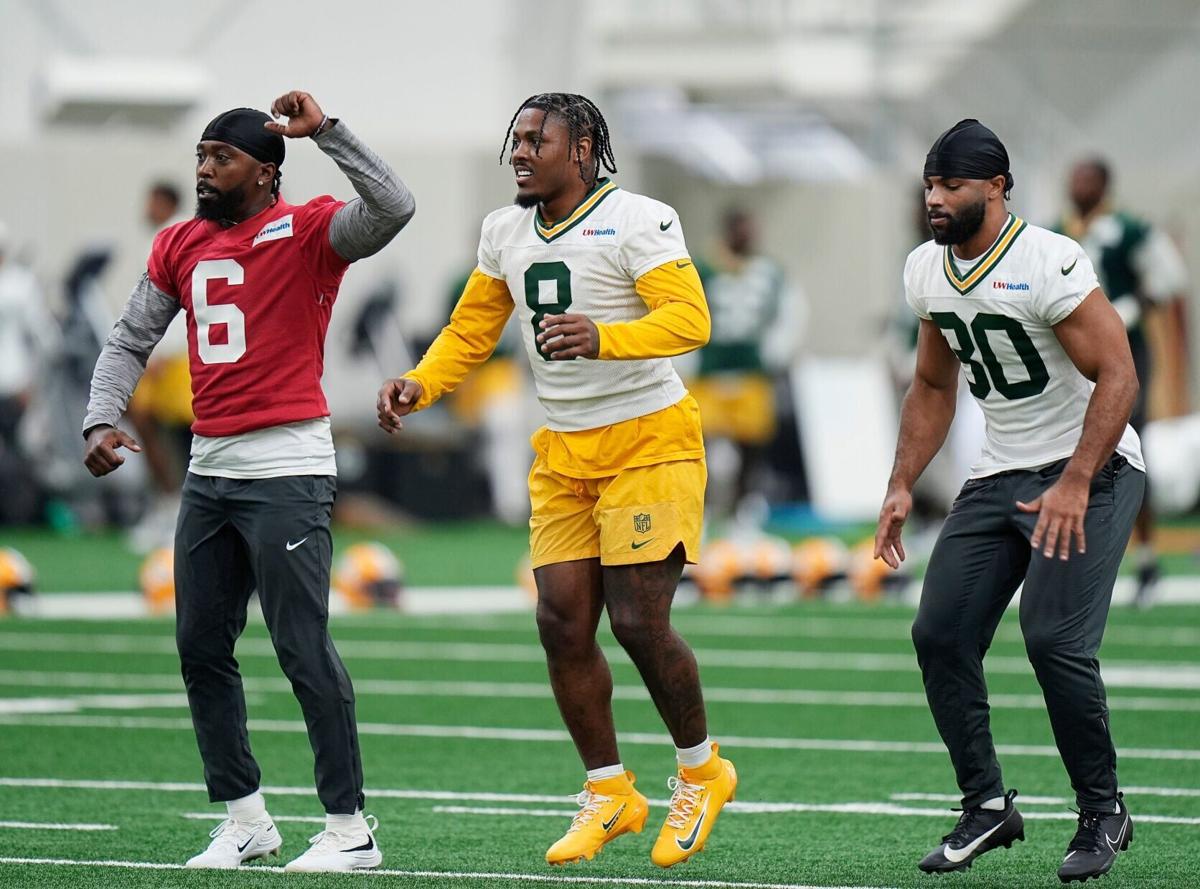 Green Bay Packers quarterback Tyrod Taylor (6), Green Bay Packers running back Josh Jacobs (8), and Green Bay Packers wide
