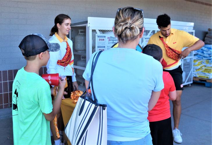 'Everyone's a Wiener' - Wienermobile Hotdoggers "Sauerkraut Kat" and "Cookout Christian" hand out Oscar Mayer swag during an Aug. 19 appearance at Daniels Foods, Walworth