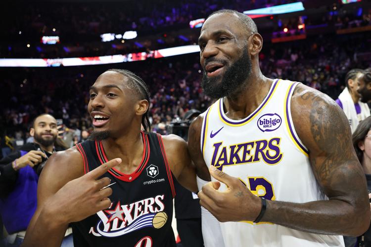 Los Angeles Lakers forward LeBron James and Philadelphia 76ers guard Tyrese Maxey react with each other after the game won by the Lakers at Xfinity Mobile Arena, Dec. 7, 2025 in Philadelphia.