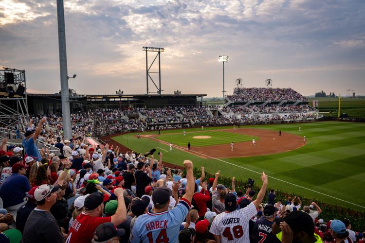 Fans cheer for a home run during a baseball game between the Philadelphia Phillies and the Minnesota Twins at the Field of