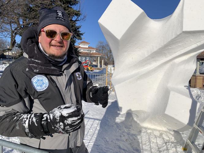 Ceyhun Konak of Team Turkiye explains the process for creating a snow sculpture