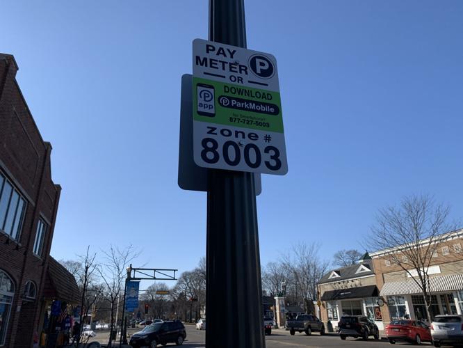 Signs have been placed throughout the downtown area to indicate where paid parking zones are located