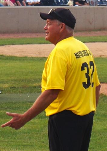 City of Loves Park, Ill. Mayor Gregory Jury questions a call at home plate July 15 at Rockford Rivets Stadium