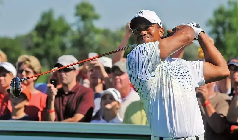 Tiger Woods tees off
