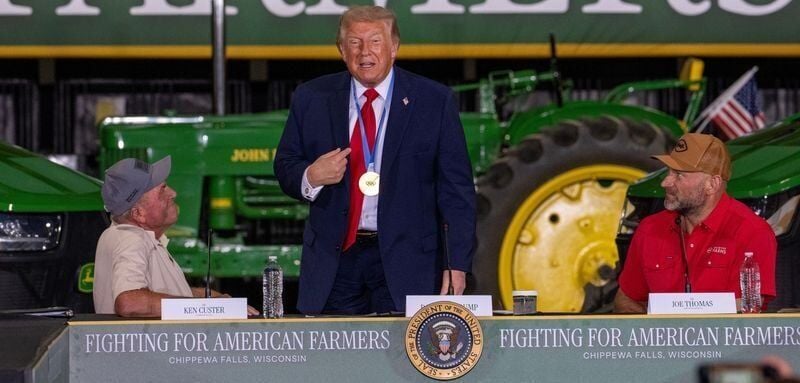 President Trump displays wears an Olympic gold medal from speedskater Jordan Stolz from Friday, June 5, 2026 at Custer Farms Inc. in Chippewa Falls, Wisconsin. Trump promoted his administration's efforts to lower costs and open new trade markets for far...