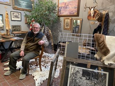 Kenneth Kurt displays some of his work at the Market of Lake Geneva during Winterfest