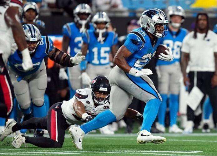 Carolina Panthers running back AJ Dillon runs with the ball during the first half against the Houston Texans at Bank of America Stadium in Charlotte, North Carolina.