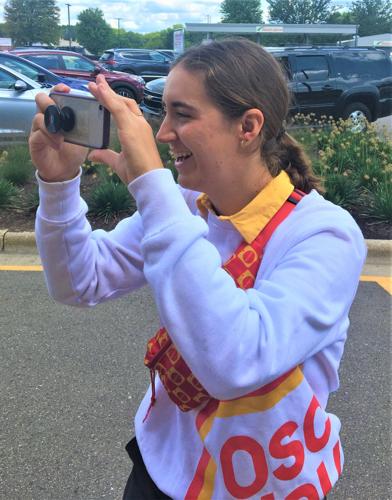 "Say Wienie!" Oscar Mayer Wienermobile Hotdogger Katherine "Sauerkraut Kat" takes a photo during a stop at Daniels Foods in Walworth