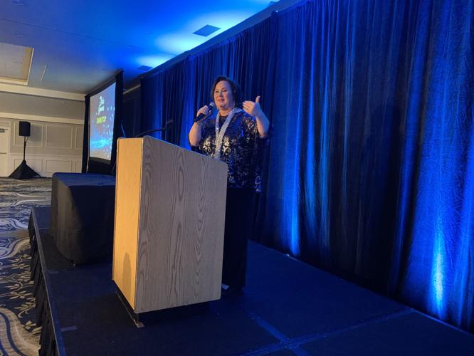 Stephanie Klett, president and CEO of Visit Lake Geneva, announces an award recipient