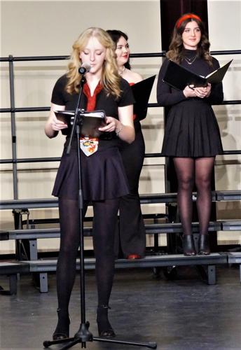 Williams Bay High School junior Brooke Peyer introduces a Vocal Jazz Choir song at the Dec. 21 Winter Concert