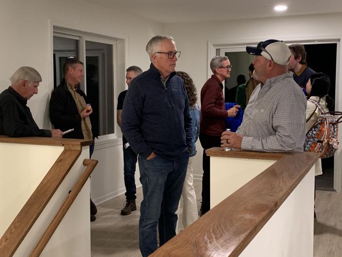 Representatives from several local businesses and organizations attended a house blessing ceremony for Habitat for Humanity's latest constructed home