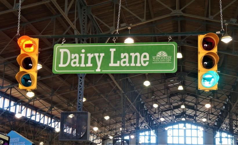 Dairy Lane sign and streetlights at a Wisconsin State Fair livestock cattle barn