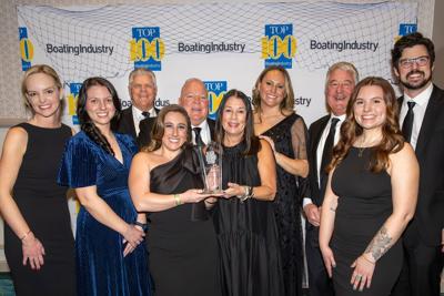 Gage Marine staff members accept the 2025 Dealer of the Year award