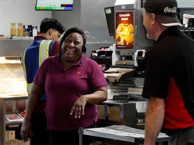 McDonald’s store manager and foster parent Donna Neal talks with employees Tuesday April, 14, 2026, in Hendersonville, Tenn. Neal has provided jobs for many of the teens she has fostered.