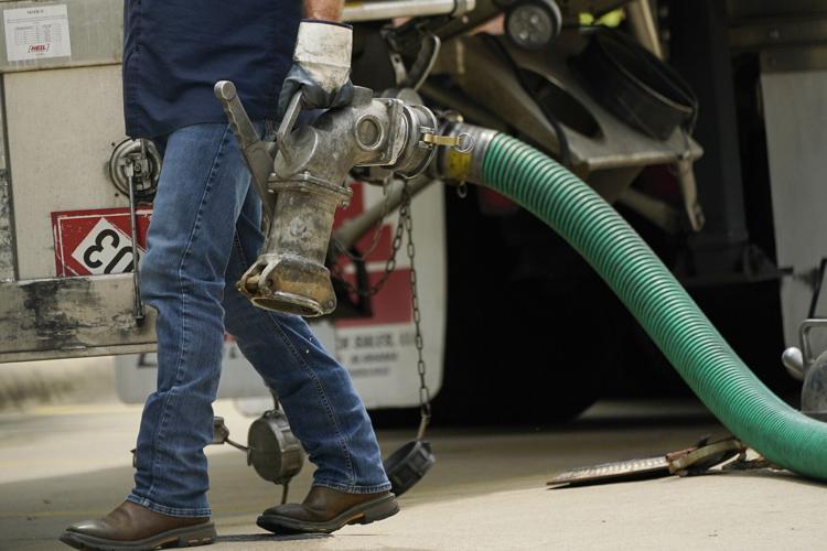 Oil drops below $100 a barrel for first time since early May