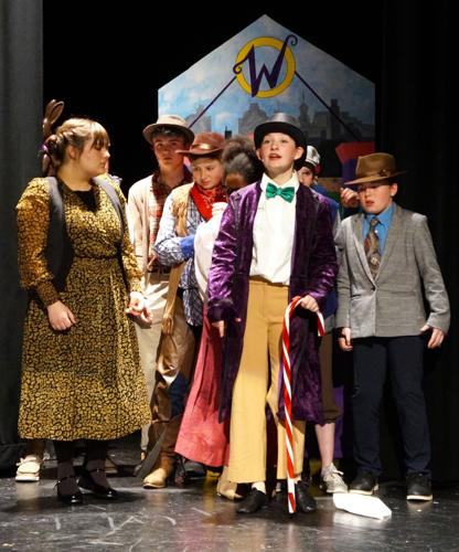 Touring confectioner Willy Wonka's famed candy and chocolates factory