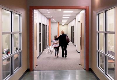 Donna and Natalie walking down hallway