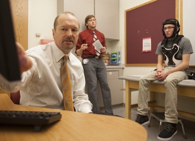 Dr. Tom Zdeblick sees patients at UW Health clinic