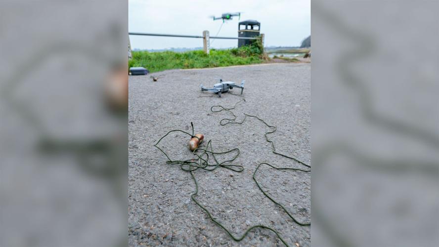 Stranded dog lured to safety by sausage dangling from a drone
