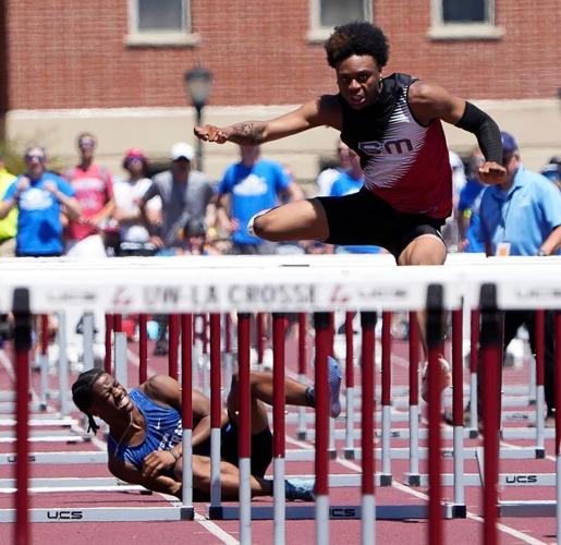 Wisconsin Lutheran High School junior Niyer Clayborn, left, falls to the ground as South Milwaukee High School senior Shaundel Williams, right, continues in the Division 2 boys 110m hurdles final during the WIAA State Track and Field meet in La Crosse, ...