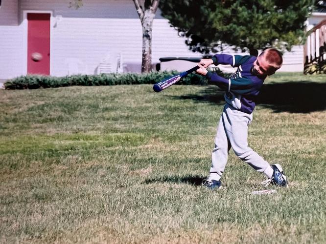 Ben Rortvedt swings at his home