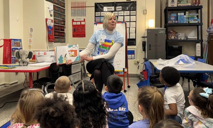 Amy Greil reads to local students