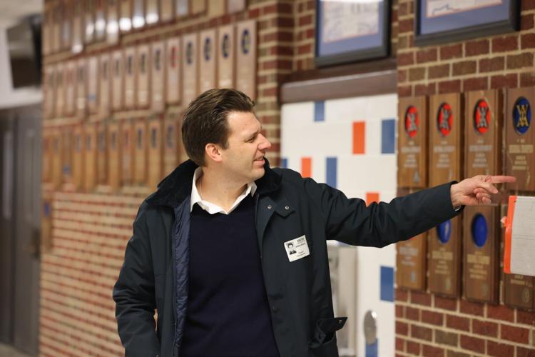 Josh Glessing points at trophy