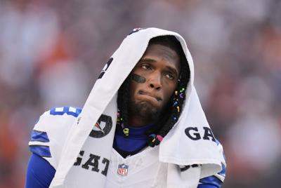 CeeDee Lamb on sidelines injured, AP photo