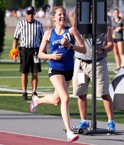 Whitefish Bay High School freshman Karstin McCabe reacts as she crosses the finish line in the Division 1 girls 3200 meter run final during the WIAA State Track and Field meet in La Crosse, Wisconsin on Saturday, June 6, 2026.