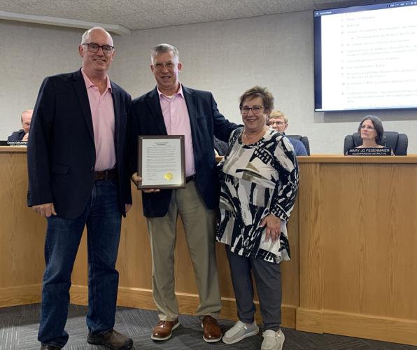Mayor Todd Krause presents a proclamation honoring the Rotary Club of Lake Geneva's 50th anniversary