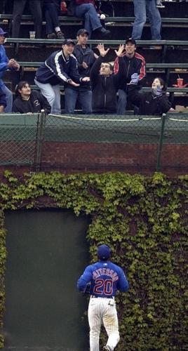 Chicago Cubs center fielder Corey Patterson can only look helplessly after Milwaukee Brewers' Richie Sexson connects for a grand slam home run in the 8th inning at Wrigley Field Sunday, May 12, 2002.