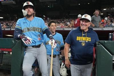 Jul 4, 2026; Phoenix, Arizona, USA; Milwaukee Brewers second baseman Brice Turang (2), designated hitter Christian Yelich (22), and manager Pat Murphy (49) before a game against the Arizona Diamondbacks at Chase Field. Mandatory Credit: Rick Scuteri-Ima...