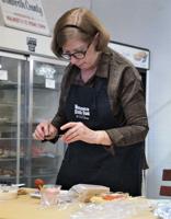 Walworth County Fair; Carol Steilein of Union Grove judges dips in the North Hall