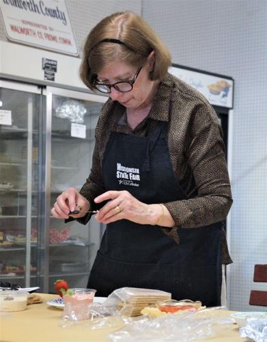 Walworth County Fair; Carol Steilein of Union Grove judges dips in the North Hall