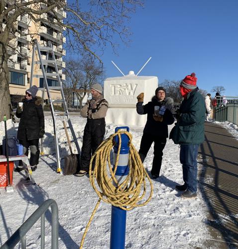Members of Minnesota team Doing our Best discuss plans for their sculpture