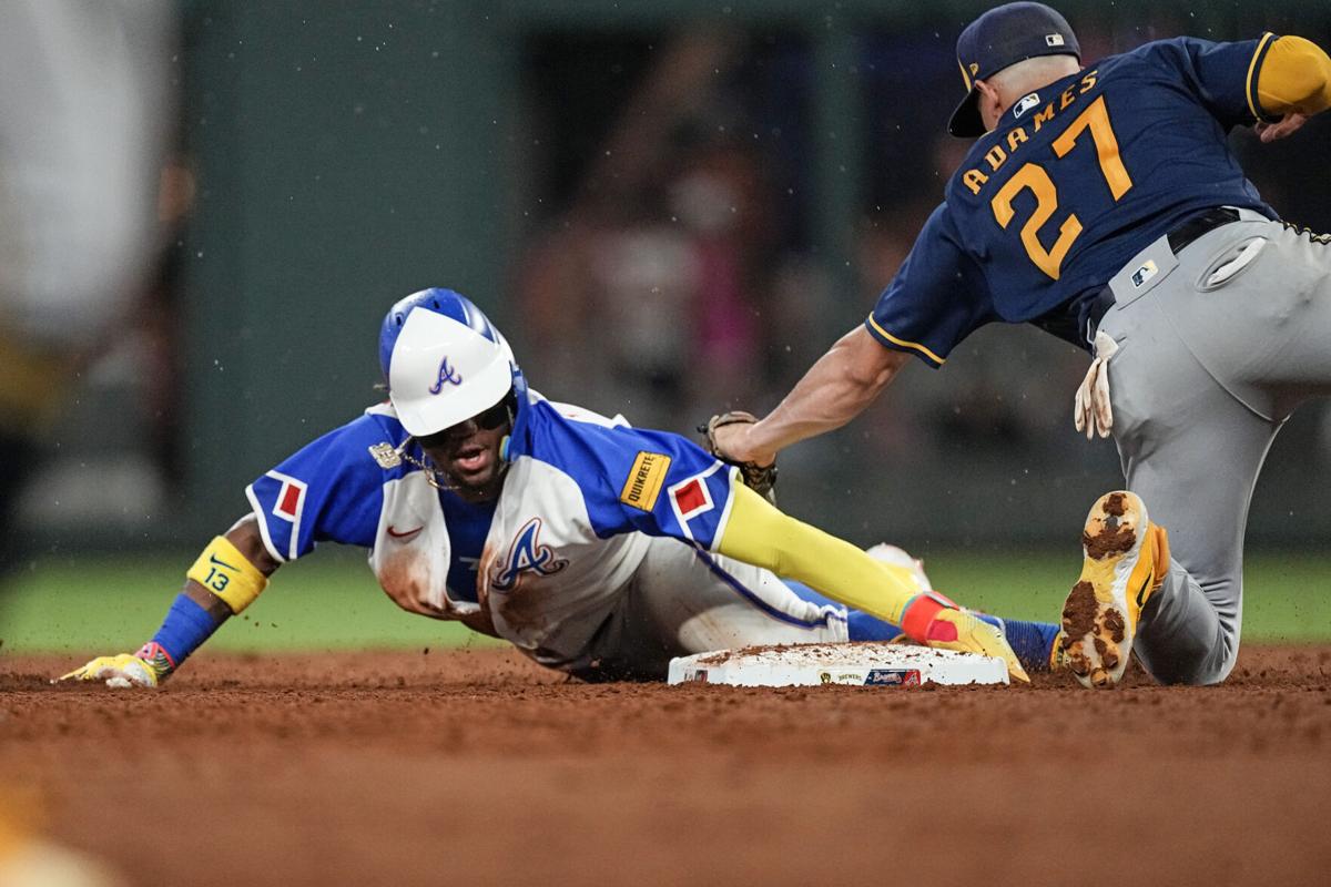 Kansas City Royals' Carlos Santana celebrates hitting an RBI double during  the fifth inning of a baseball game against the Texas Rangers, Friday, June  25, 2021, in Arlington, Texas. (AP Photo/Brandon Wade