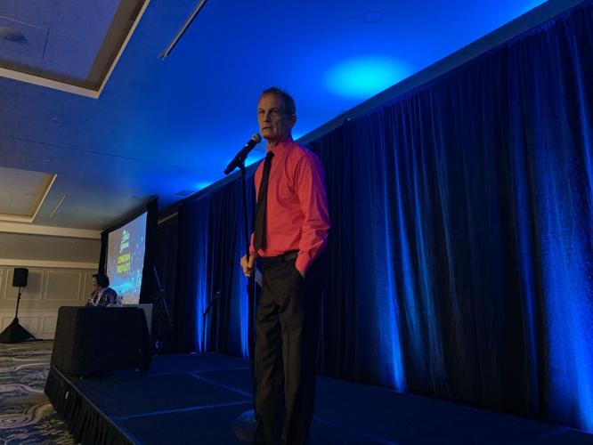 Comedian Fred Klett entertains the audience during the Impact Awards dinner