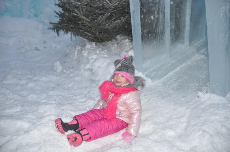 Chloe Rasmussen has fun sliding down at the ice castle