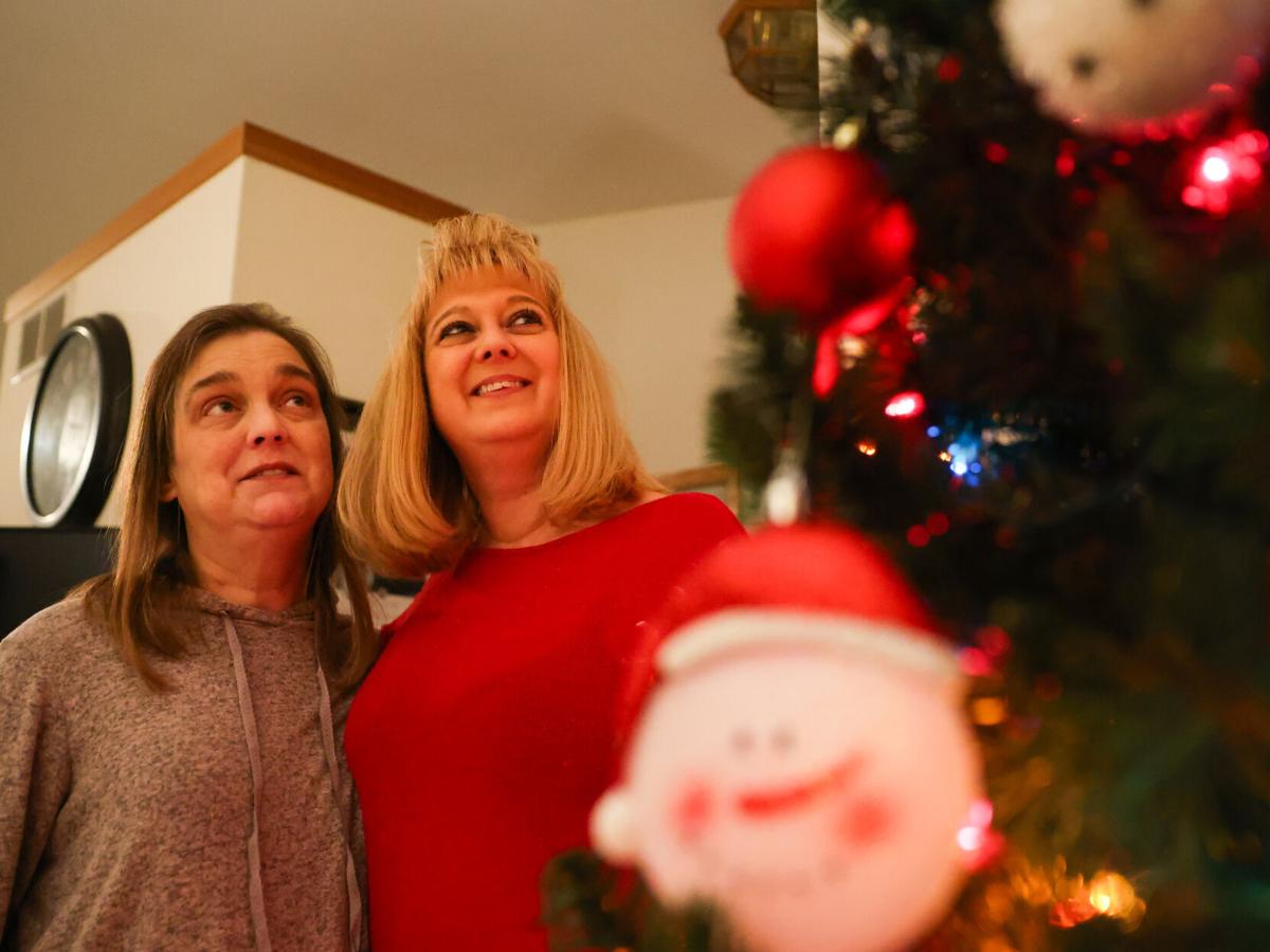 Jaime and Vikki by Christmas tree