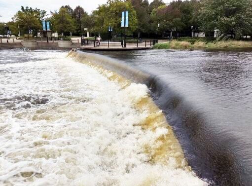 Dam on Fox River in Waukesha at Saratoga Lake submerges under water