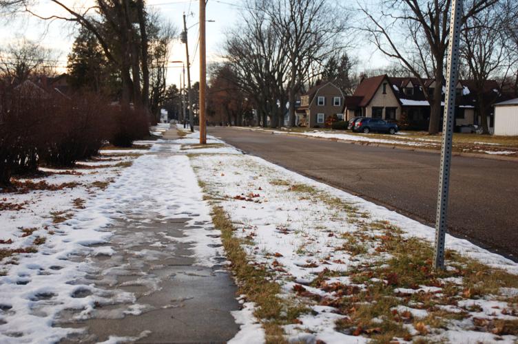 Snowy sidewalk in Village of Walworth